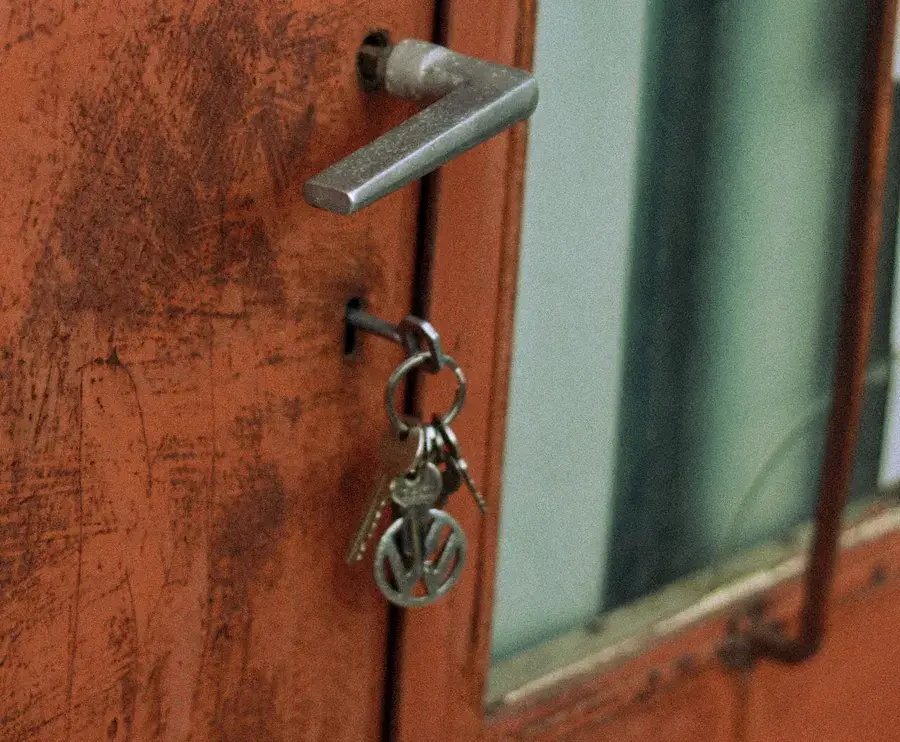 Keys hanging from the lock of an old door – why keys snap and when broken key removal Runcorn is needed, Locksmith Runcorn