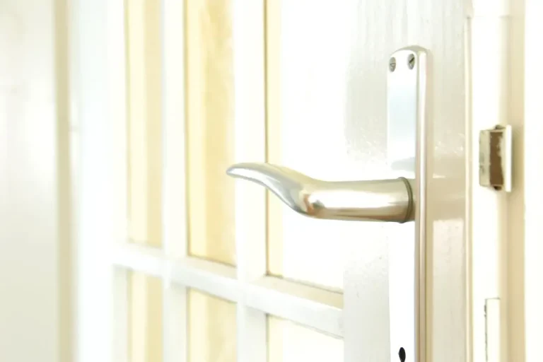 Lock repair or replacement in Runcorn – white door with a lever handle and locking plate, Locksmith Runcorn guide to which your door needs