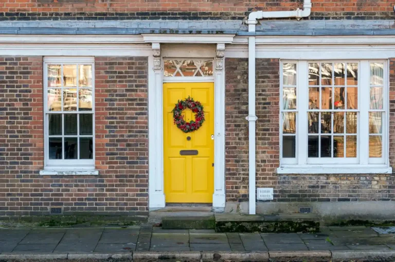 Types of door locks in the UK – yellow front door on a red-brick Victorian house in Runcorn, Locksmith Runcorn guide to identifying your lock